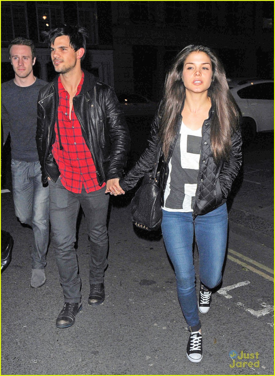 taylor lautner marie avgeropoulos matching jackets london 10